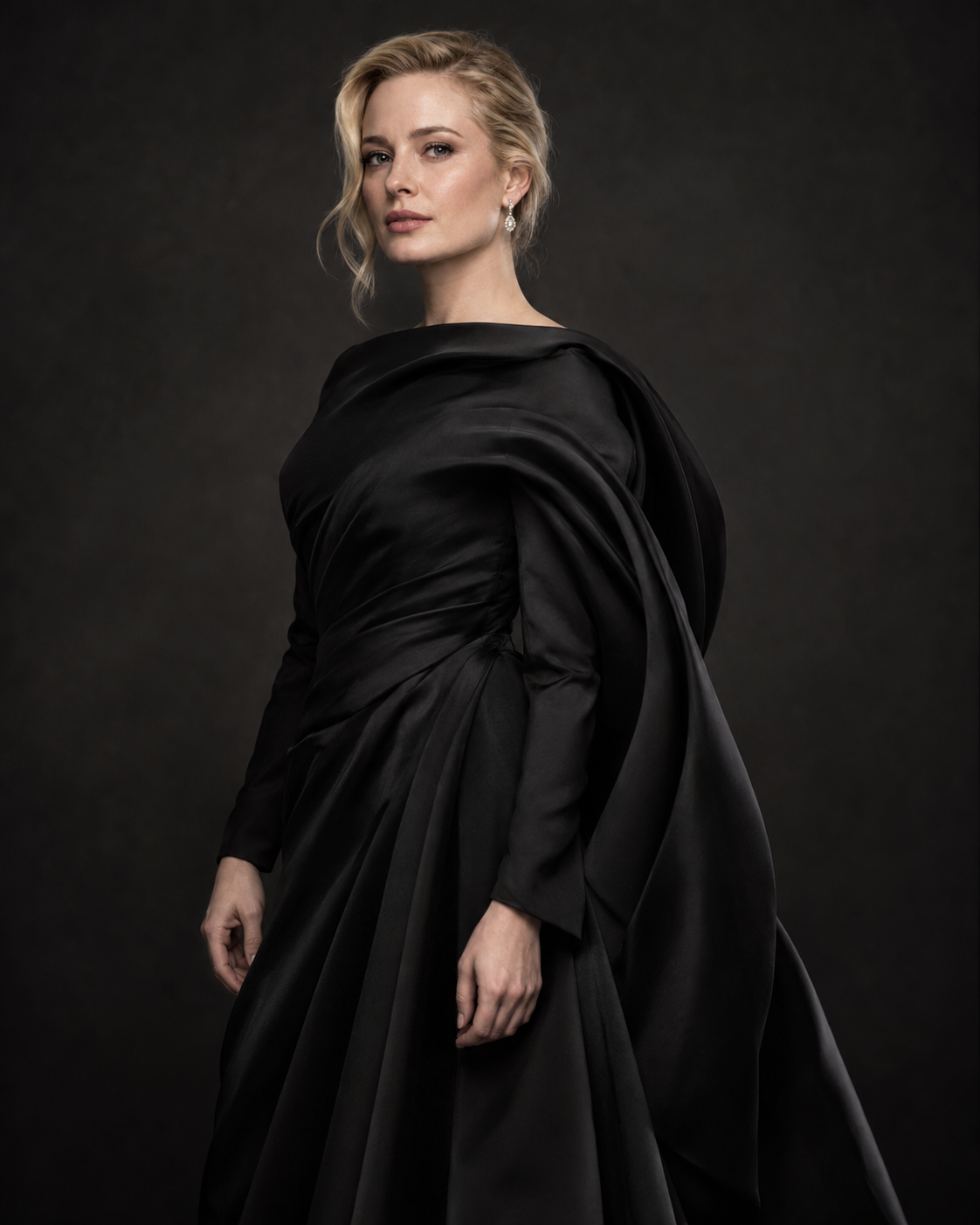 Model in a black off-shoulder gown
